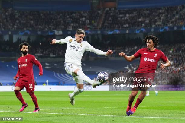 Federico Valverde of Real Madrid controls the ball whilst under pressure from Trent Alexander-Arnold of Liverpool during the UEFA Champions League...