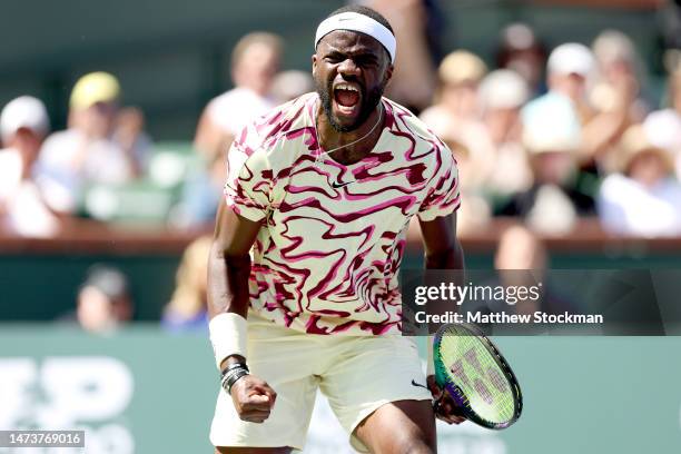 Frances Tiafoe of the United States celebrates match point against Cameron Norrie of Great Britain during the BNP Paribas Open at the Indian Wells...