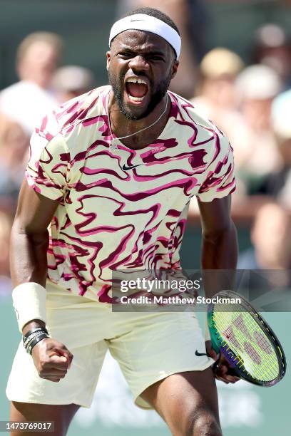 Frances Tiafoe of the United States celebrates match point against Cameron Norrie of Great Britain during the BNP Paribas Open at the Indian Wells...