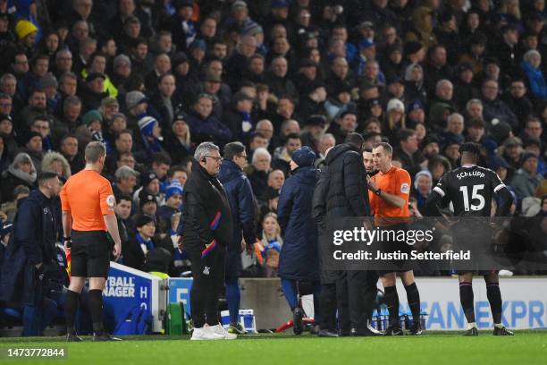 Referee Peter Bankes speaks with Patrick Vieira, Manager of Crystal Palace, and Roberto De Zerbi, Manager of Brighton & Hove Albion, after the lights...