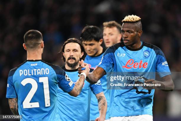 Victor Osimhen of SSC Napoli celebrates with Matteo Politano after scoring the team's first goal during the UEFA Champions League round of 16 leg two...