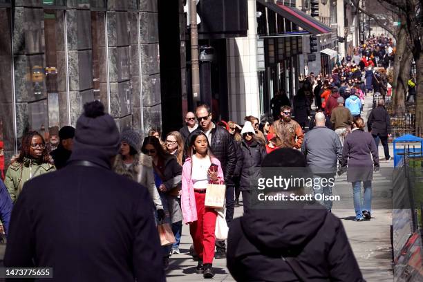 People walk along the Magnificent Mile shopping district on March 15, 2023 in Chicago, Illinois. Retail sales slipped 0.4 percent in February after...