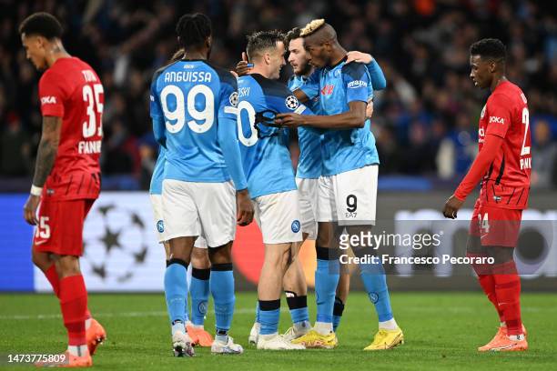 Victor Osimhen of SSC Napoli celebrates with team mates after scoring the team's first goal during the UEFA Champions League round of 16 leg two...