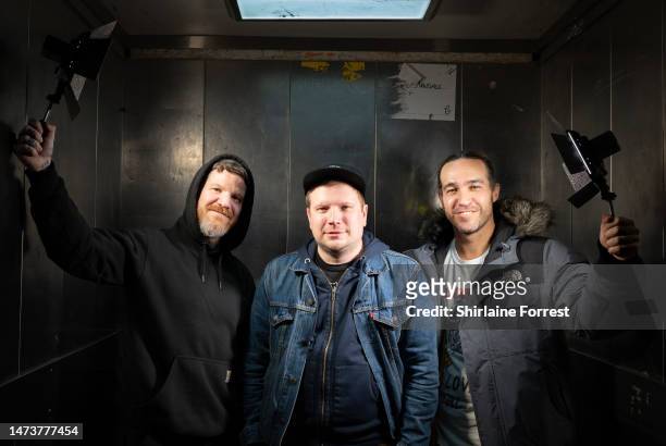 Andy Hurley, Patrick Stump and Pete Wentz pose backstage after attending the Fall Out Boy Signing at HMV Manchester on March 15, 2023 in Manchester,...