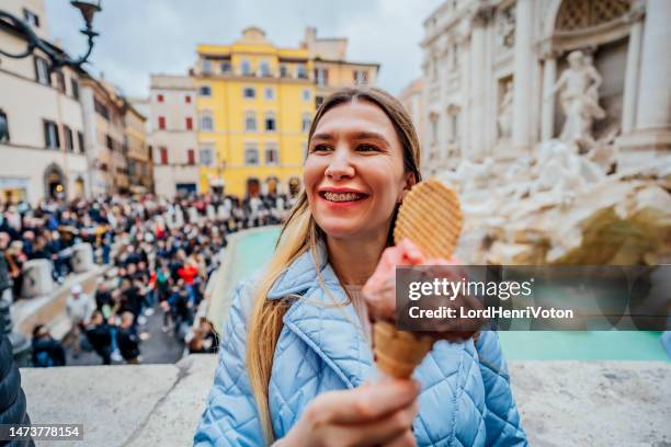 woman with ice cream in front of the trevi fountain - food sculpture stock pictures, royalty-free photos & images