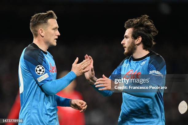 Piotr Zielinski of SSC Napoli celebrates with Khvicha Kvaratskhelia after scoring the team's third goal during the UEFA Champions League round of 16...