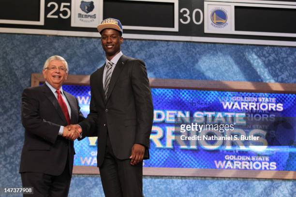 Harrison Barnes shakes hands with NBA Commissioner David Stern after being selected number seven overall by the Golden State Warriors during the 2012...