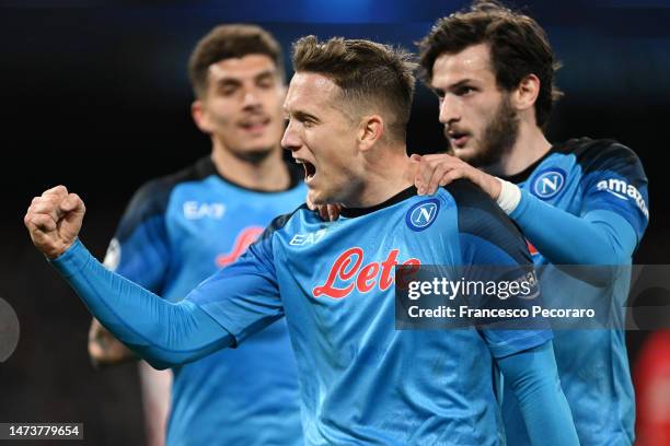 Piotr Zielinski of SSC Napoli celebrates with Khvicha Kvaratskhelia after scoring the team's third goal during the UEFA Champions League round of 16...