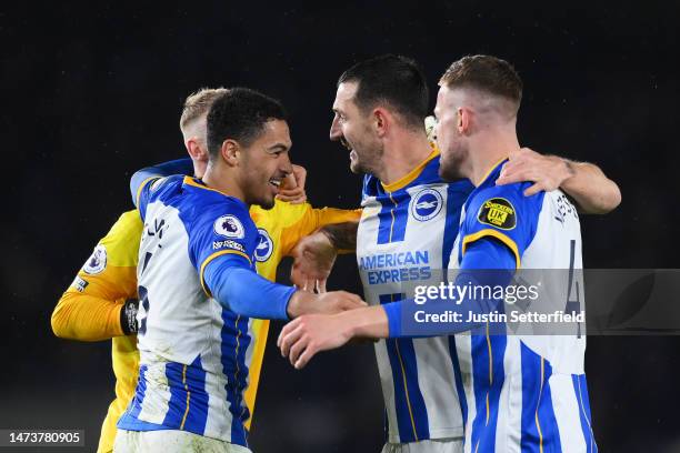 Levi Colwill celebrates victory with teammates Jason Steele, Lewis Dunk and Adam Webster of Brighton & Hove Albion after the Premier League match...