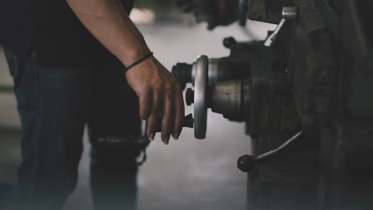 https://media.gettyimages.com/id/1473783152/video/high-precision-cnc-machining-center-cnc-lathe-working-operator-machining-automotive-sample.jpg?b=1&s=640x640&k=20&c=Y80edRbGAKWsAn2LxyHndUsrn5cnPTgDKIvxqKvcFL0=