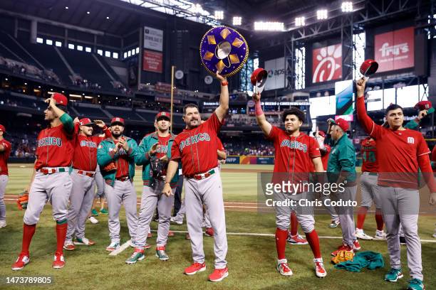 Manager Benji Gil and Jonathan Aranda of Team Mexico acknowledge the crowd after Mexico beat Team Canada 10-3 during the World Baseball Classic Pool...