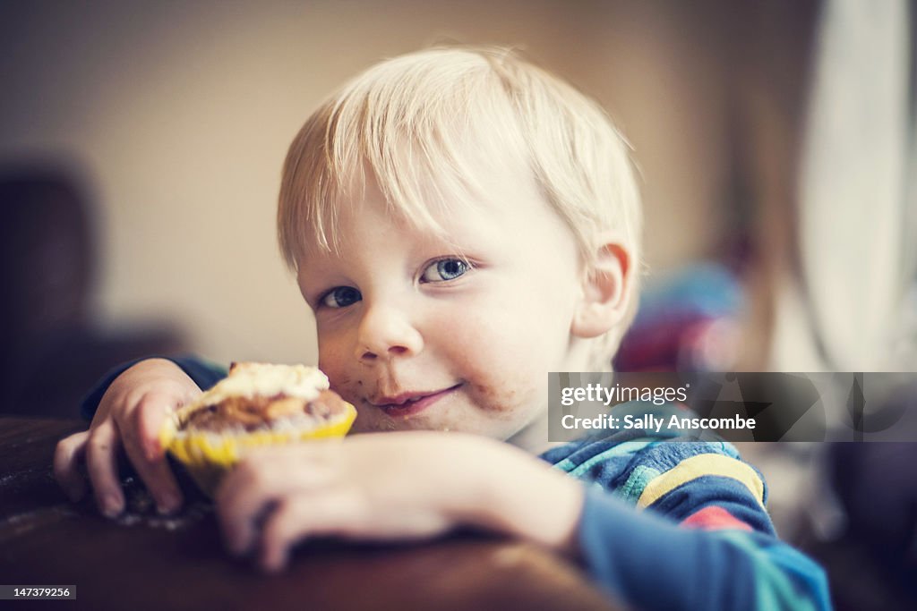 Child eating cupcake