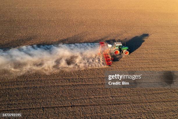 tractor plants grain corn, aerial view - plöjd åker bildbanksfoton och bilder