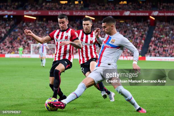 Ferran Torres of FC Barcelona duels for the ball with Alejandro Berenguer of Athletic Club during the LaLiga Santander match between Athletic Club...