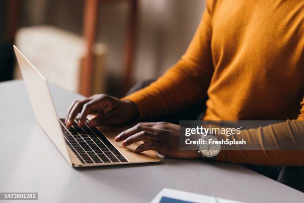 an unrecognizable businessman working on his computer - keyboard instrument stock pictures, royalty-free photos & images