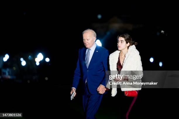 President Joe Biden and his granddaughter Natalie Biden walk across the South Lawn after returning to the White House on Marine One on March 15, 2023...