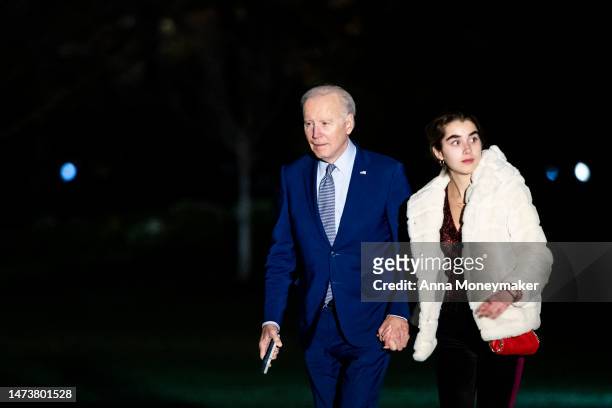 President Joe Biden and his granddaughter Natalie Biden walk across the South Lawn after returning to the White House on Marine One on March 15, 2023...