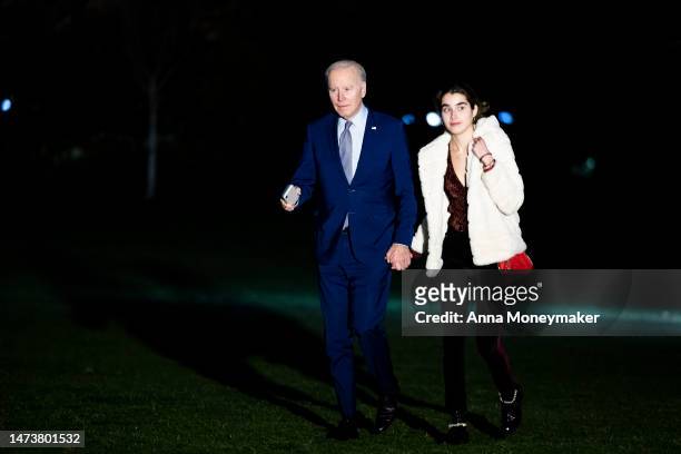 President Joe Biden and his granddaughter Natalie Biden walk across the South Lawn after returning to the White House on Marine One on March 15, 2023...