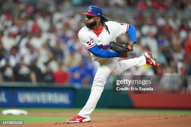 Johnny Cueto of The Dominican Republic throws a pitch during the first inning of the World Baseball Classic Pool D game against Puerto Rico at...