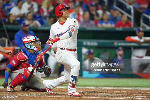 Juan Soto of The Dominican Republic hits a home run in the third inning of the World Baseball Classic Pool D game against Puerto Rico at loanDepot...
