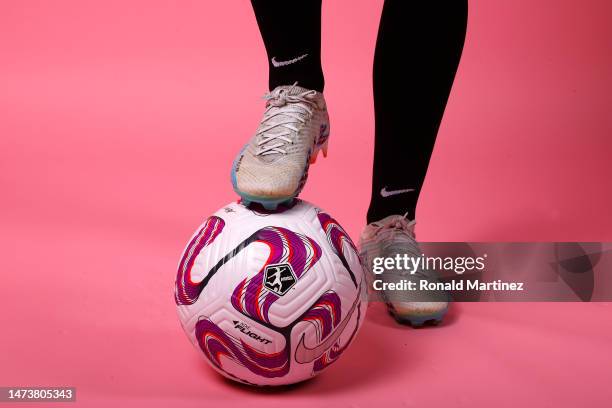 Savannah McCaskill of Angel City FC places her foot on a NWSL soccer ball on media day on March 13, 2023 in Sun Valley, California.