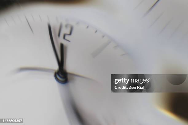 distorted image of a clock - 12 o'clock stock pictures, royalty-free photos & images