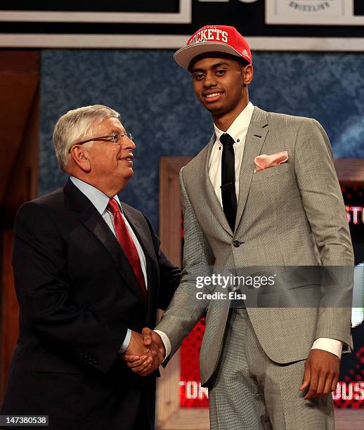 Jeremy Lamb of the Connecticut Huskies greets NBA Commissioner David Stern after he was selected number twelve overall by the Houston Rockets during...