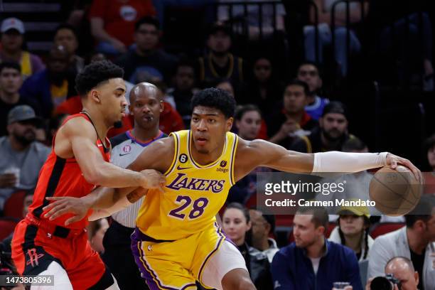 Rui Hachimura of the Los Angeles Lakers controls the ball against Kenyon Martin Jr. #6 of the Houston Rockets during the first half at Toyota Center...