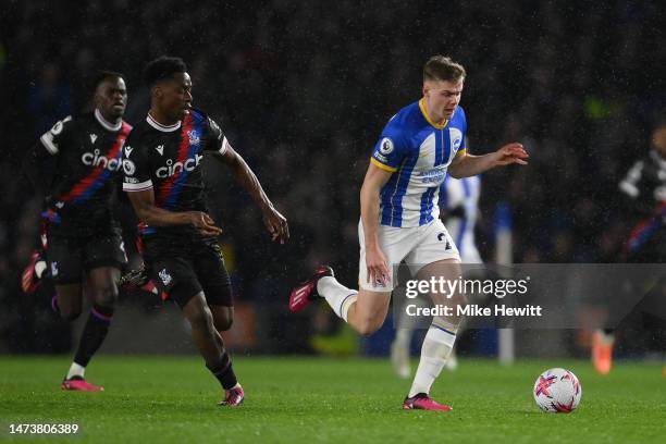 Evan Ferguson of Brighton & Hove Albion gets away from Albert Sambi Lokonga of Crystal Palace during the Premier League match between Brighton & Hove...