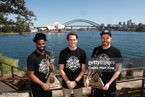 Derrick Walton Jr. Of the Kings, Kings head coach Chase Buford and Angus Glover of the Kings pose with the 2022 and 2023 NBL Championship trophies...