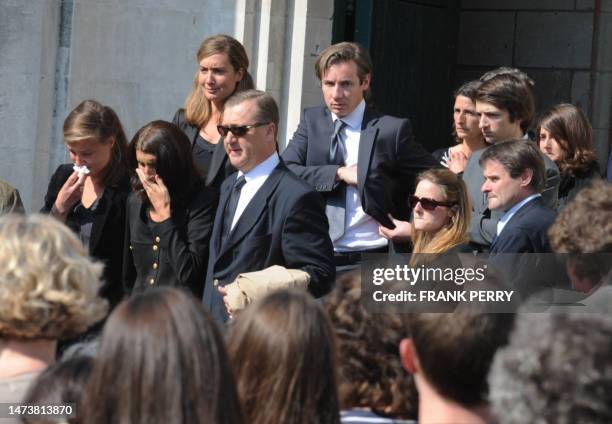 Members of the Dupont Ligonnes family leave the church of Saint Felix, in the French western city of Nantes, on April 28 at the end of the funeral...