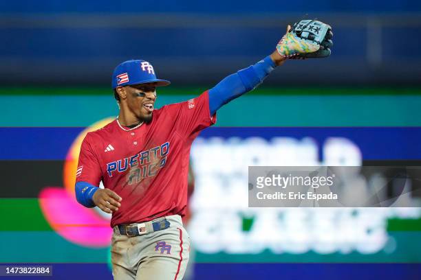 Francisco Lindor of Puerto Rico points towards the dugout after making a play during the sixth inning during the World Baseball Classic Pool D game...