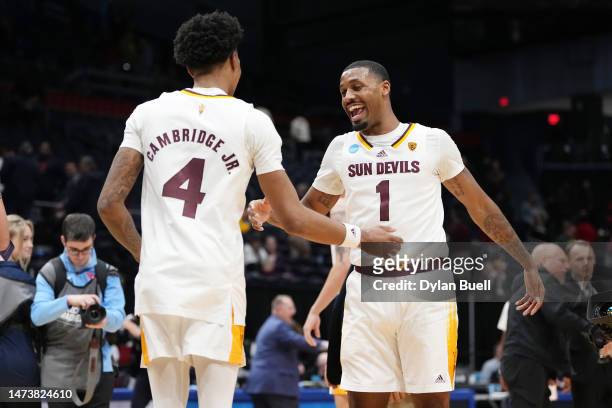 Luther Muhammad and Desmond Cambridge Jr. #4 of the Arizona State Sun Devils celebrate after defeating the Nevada Wolf Pack in the First Four game of...