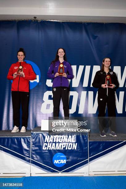 Kaley McIntyre of the NYU Violets stands atop the podium after winning the 50 Freestyle during the Division III Women’s Swimming & Diving...