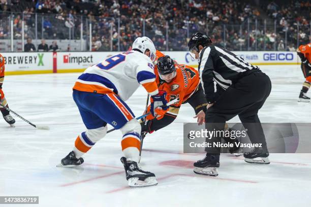 Isac Lundestrom of the Anaheim Ducks battles Brock Nelson of the New York Islanders during the faceoff in the first period at Honda Center on March...