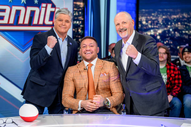 Host Sean Hannity with Conor McGregor and Frank Siller during their visit to "Hannity" at Fox News Channel Studios on March 15, 2023 in New York City.