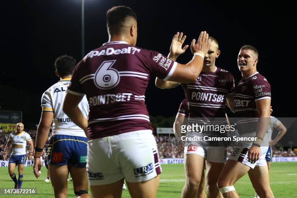 Reuben Garrick of the Sea Eagles celebrates with team mates after scoring a try during the round three NRL match between Manly Sea Eagles and...