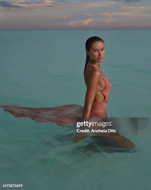 sunset swimming - asian swimsuit models stock pictures, royalty-free photos & images