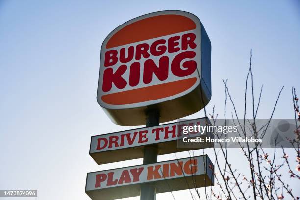 Burger King road sign advertising Drive Thru and Play King is seen outside a local fast food restaurant on March 15, 2023 in Alges, Portugal.