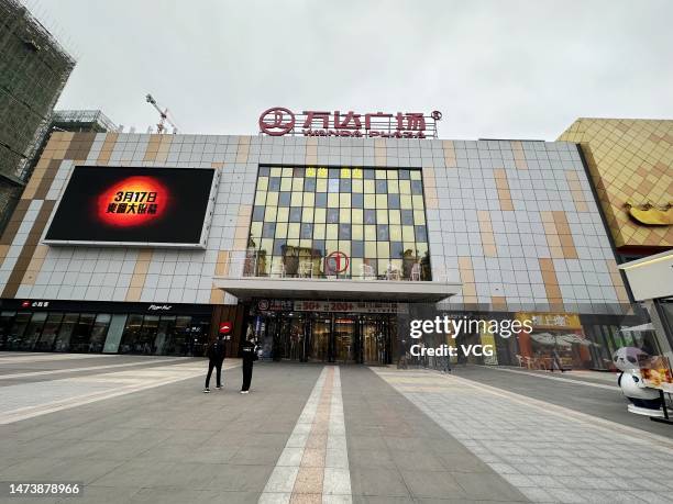 Citizens walk into Wanda Plaza shopping mall on March 15, 2023 in Yulin, Guangxi Zhuang Autonomous Region of China.