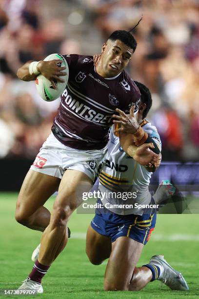 Tolutau Koula of the Sea Eagles is tackled during the round three NRL match between Manly Sea Eagles and Parramatta Eels at 4 Pines Park on March 16,...