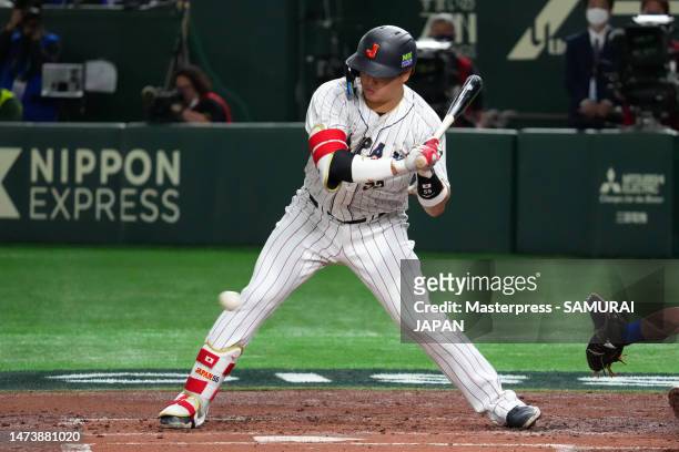 Munetaka Murakami of Japan strikes out in the first inning during the World Baseball Classic quarterfinal between Italy and Japan at Tokyo Dome on...