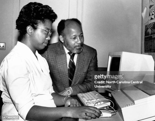 William Thomas Fletcher and student looking at a computer at North Carolina Central University, in Durham, North Carolina.