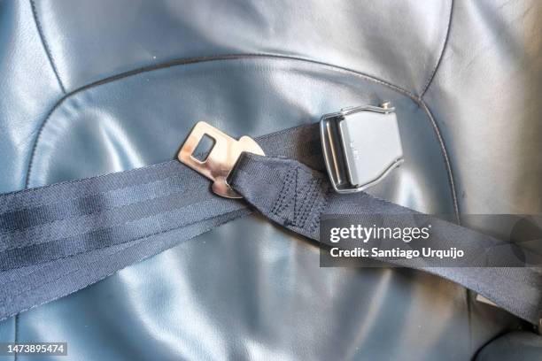 seat belt on an airplane seat - airplane seats stock pictures, royalty-free photos & images