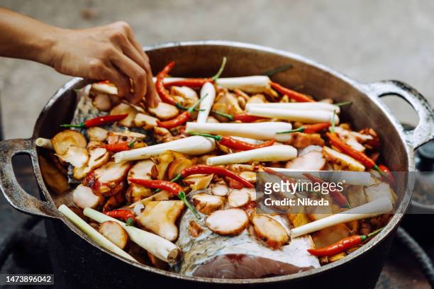 huge cooking pan with fish and vegetables in vietnam - vietnamese food stock pictures, royalty-free photos & images