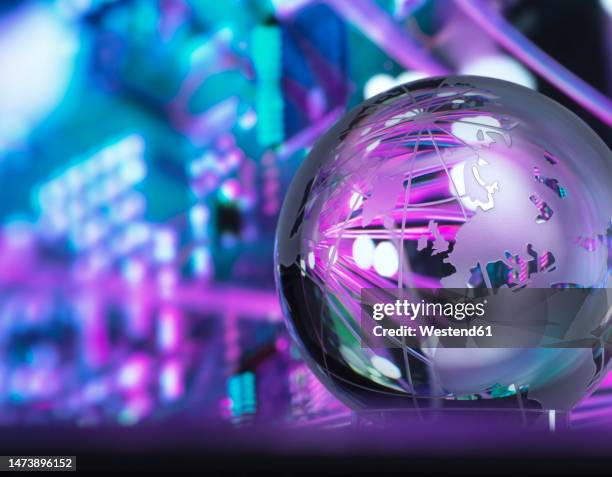 crystal globe with fibre optics processing data in background - global business stock illustrations