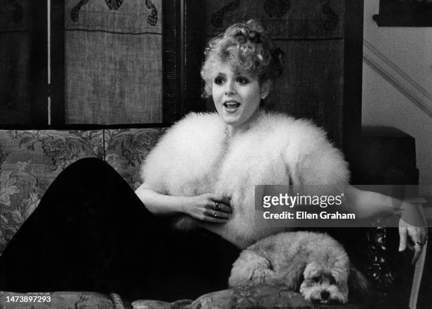 Actor and entertainer Bernadette Peters with her pet dog, Los Angeles, California, 1976.