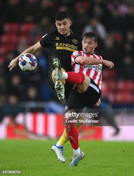 Sunderland player Joe Gelhardt is challenged by John Egan of Sheffield United during the Sky Bet Championship between Sunderland and Sheffield United...