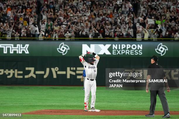 Munetaka Murakami of Japan celebrates hitting a RBI double to make it 2-5 in the fifth inning during the World Baseball Classic quarterfinal between...
