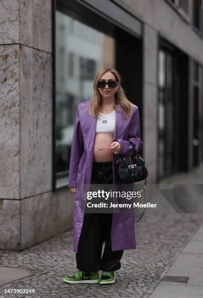 Sonia Lyson seen wearing Prada Moon black leather bag, Carolina Herrera black sparkling sunglasses, Nike green and black Air Jordan leather sneaker,...